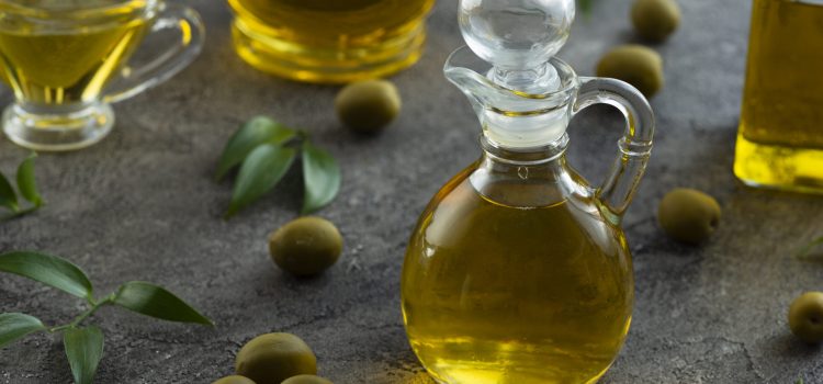 high-view-bottles-filled-with-olive-oil-marble-background